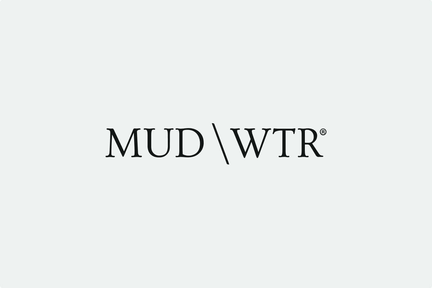 Text logo displaying "MUD\WTR" in a minimalist font on a light gray background.